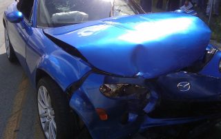 Blue sports car in a car accident
