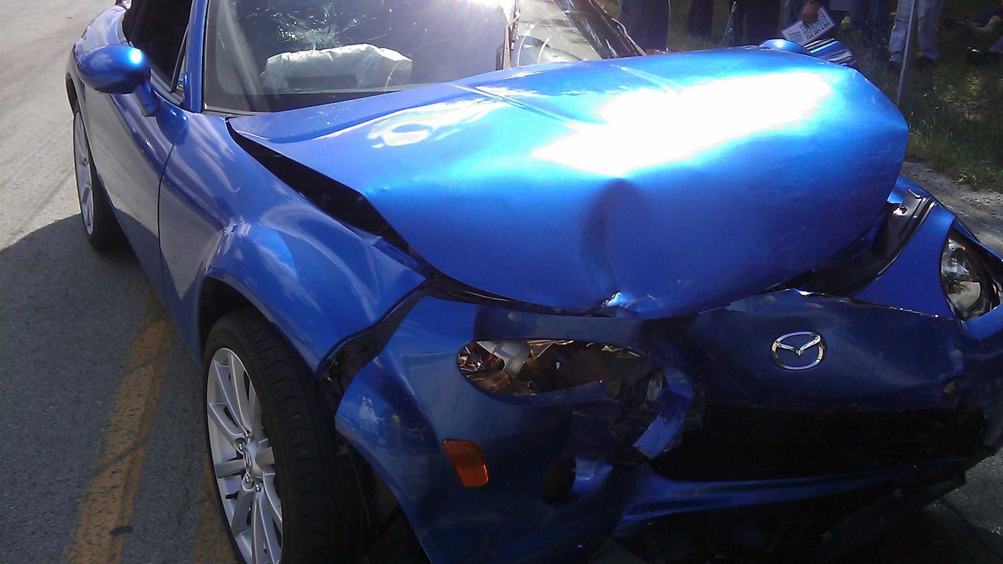 Blue sports car in a car accident