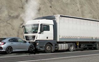 Truck accident involving a car on the highway
