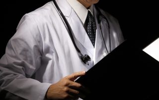 Doctor reviewing medical notes