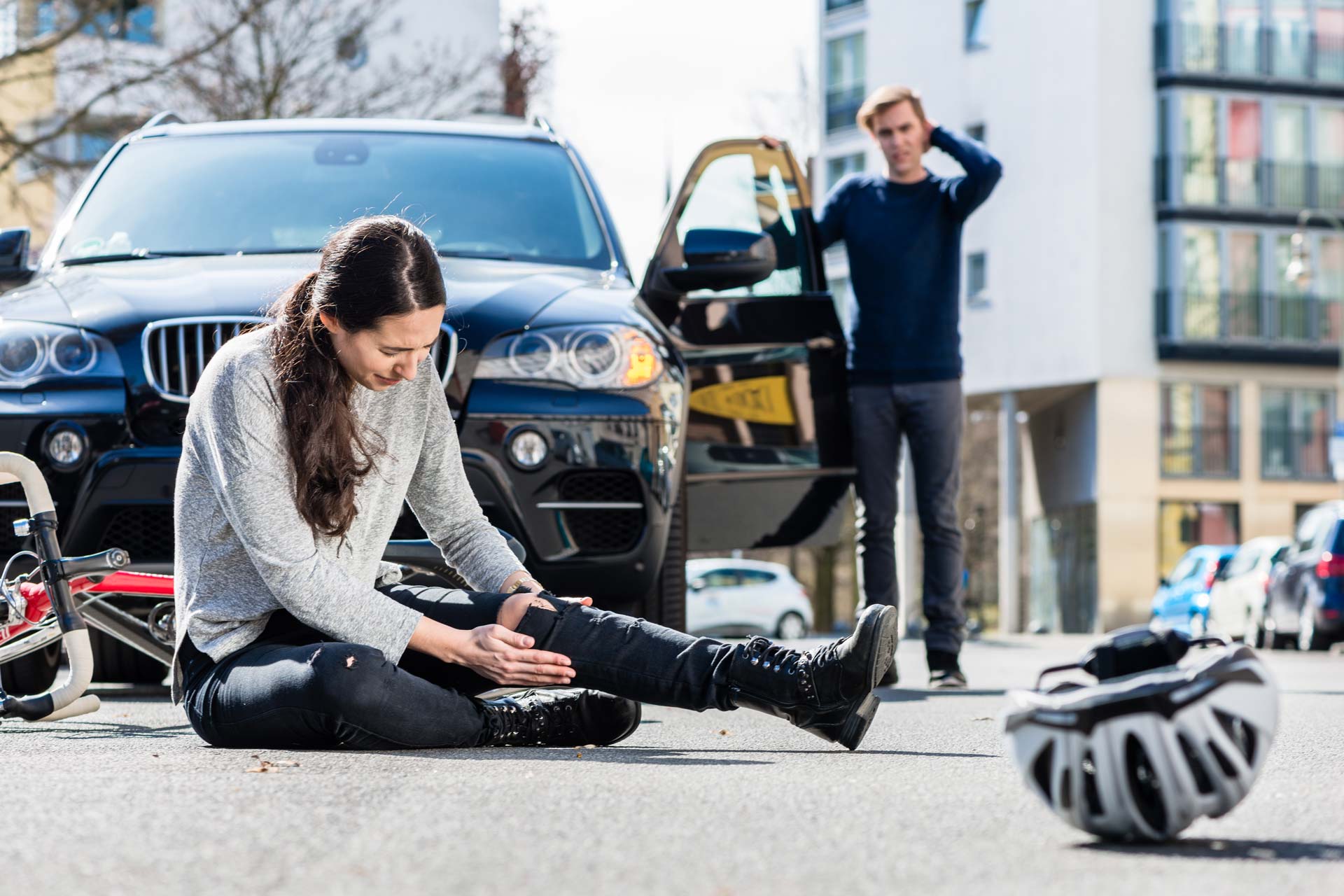 Woman on a bike hit by a car