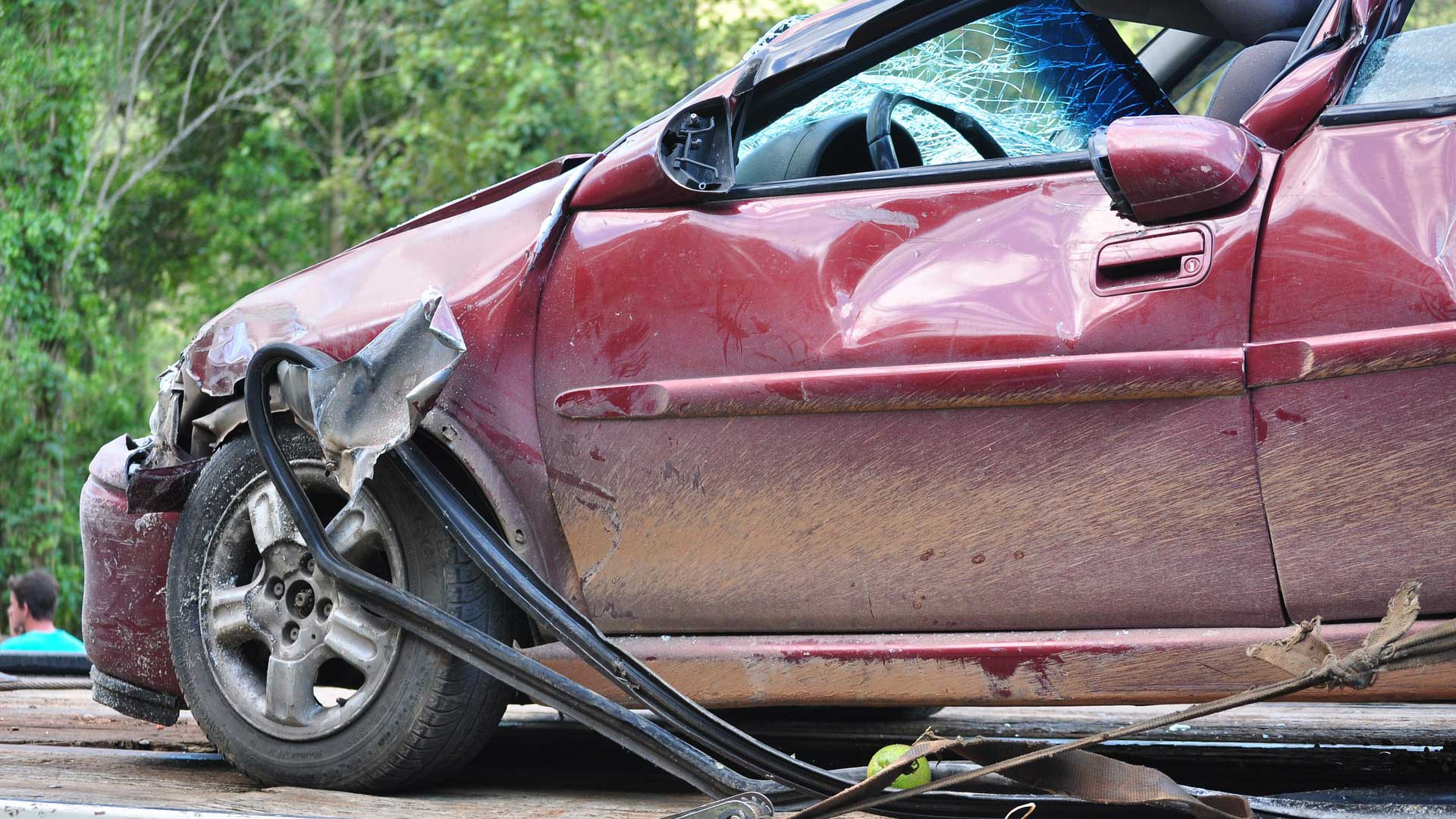 Red car in crash with severe damage