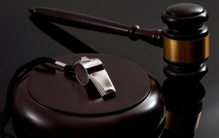 Gavel next to a whistle