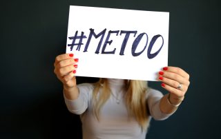 Woman holding up a Me Too sign