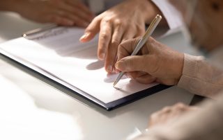 Woman signing life care plan