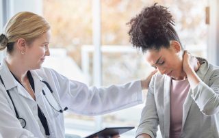 Doctor speaking with injured woman