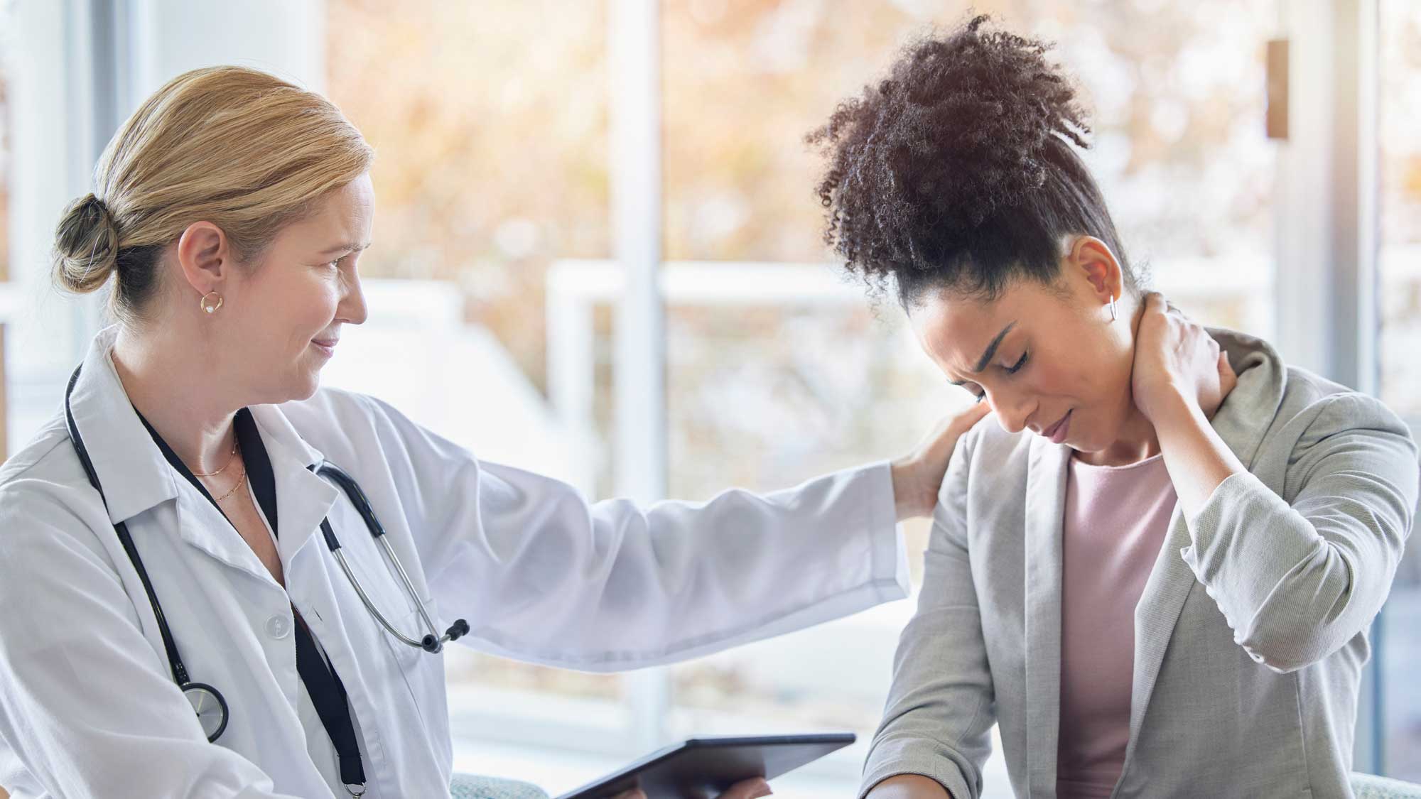 Doctor speaking with injured woman