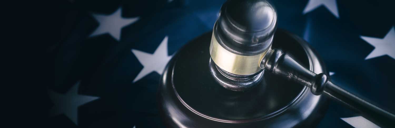 Gavel on top of the stars of the American flag