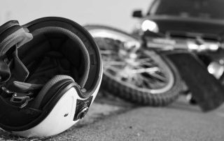Motorcycle accident with helmet on the pavement