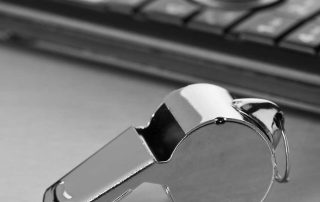 Whistle and a cell phone on a table